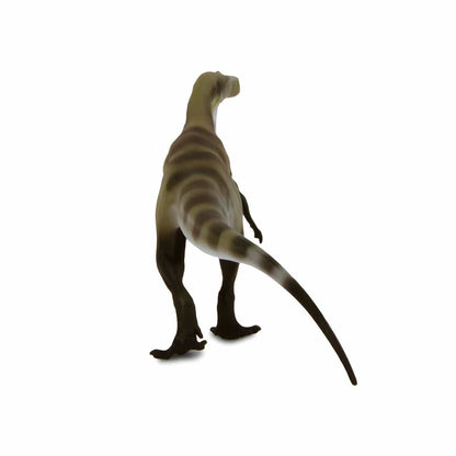 Figura de borracha Megalosaurus vista de trás, com a cauda comprida