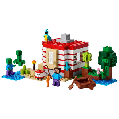 Lego Minecraft A Casa TNT da Selva montada com minifiguras e barco