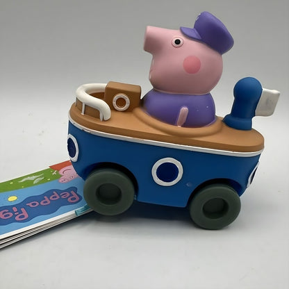 Mini veículo Grandpa Pig fotografado sobre fundo cinzento