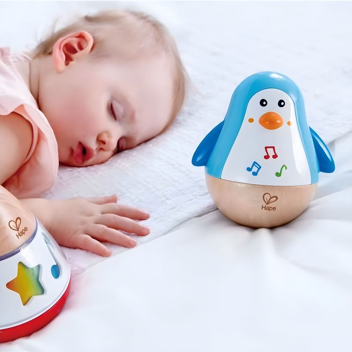 Brinquedo musical Hape em forma de pinguim oscilante