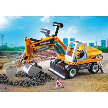 Playmobil 71749 Escavadora grande numa obra com pedras e prédios ao fundo