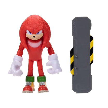 Figura Knuckles vermelha de frente ao lado da prancha de snowboard