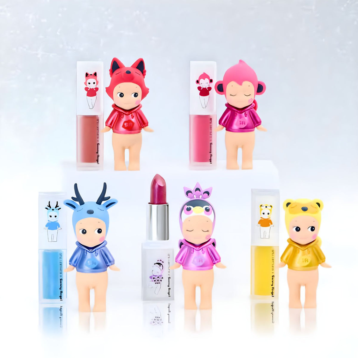 Imagem promocional da série Makeup Angel de Sonny Angel e shu uemura, em tons rosa e violeta