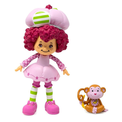 Boneca Strawberry Shortcake Raspberry Tart de vestido rosa ao lado do macaco Rhubarb