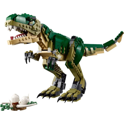 T. rex LEGO Creator verde e bege montado com mandíbula aberta e ninho de ovos