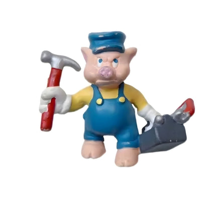 Os três porquinhos Jimmy: figura do porquinho com martelo e caixa de ferramentas, de lado