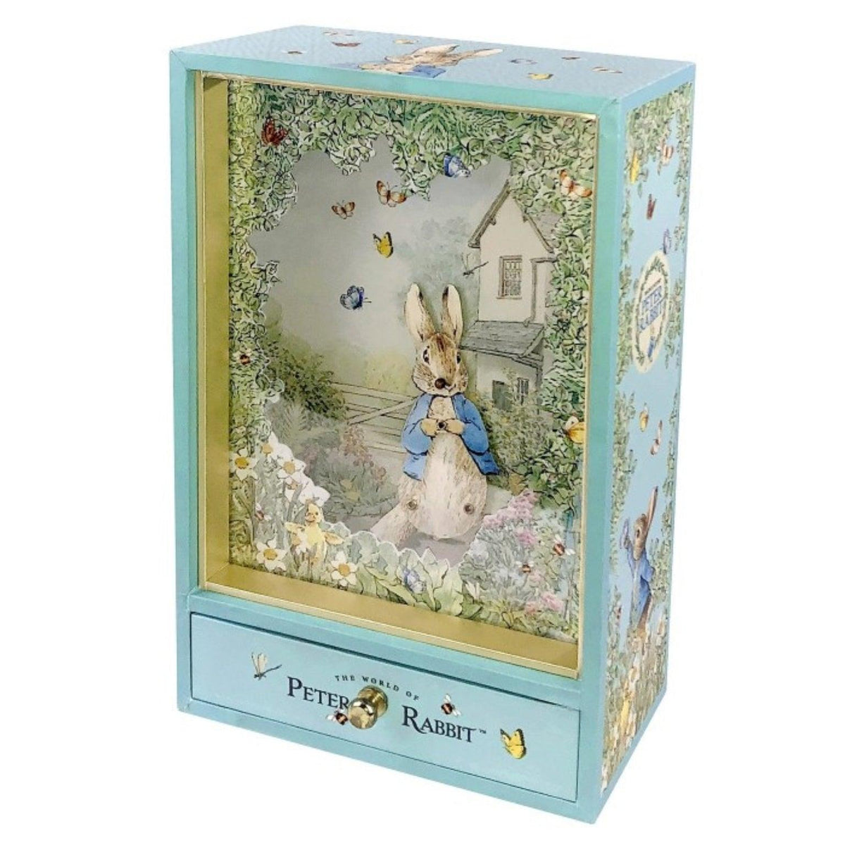 Caixa de Música Peter Rabbit Garden azul, com cenário de jardim e gaveta frontal