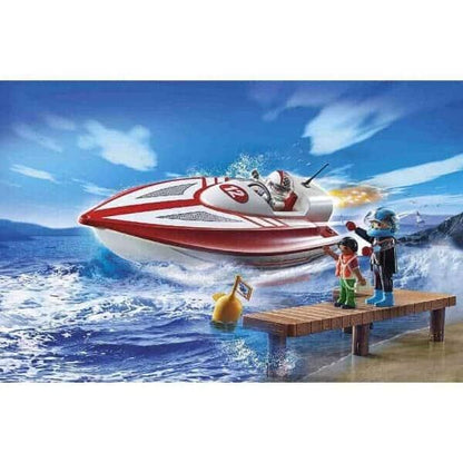 Lancha Playmobil 70744 vermelha e branca no mar junto a um cais