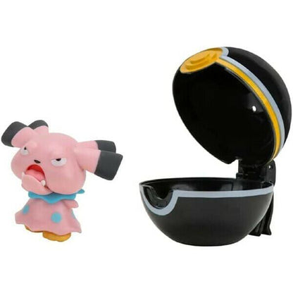 Figura Snubbull cor-de-rosa ao lado da Luxury Ball preta aberta