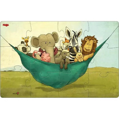 Puzzle Leão 2 x 12 peças montado com leão, elefante e zebra deitados numa rede verde