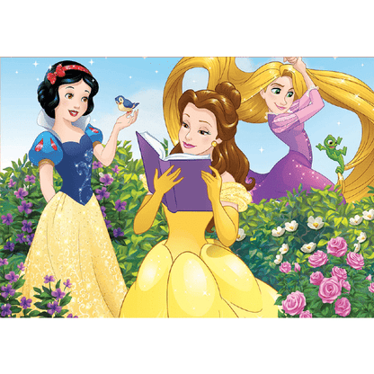 Imagem do Puzzle Princesas Disney com Branca de Neve, Bela a ler e Rapunzel num jardim